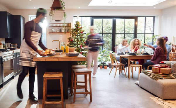 family celebrating the holidays in kitchen