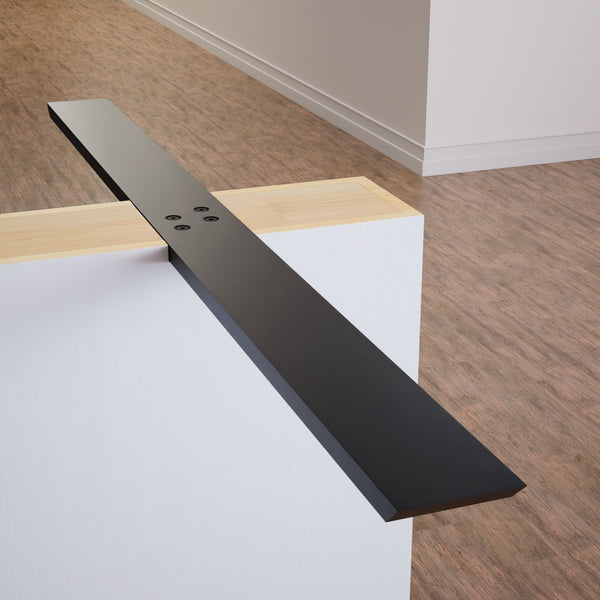 Black Flat Wall Bracket on a white half wall on a light brown wood floor