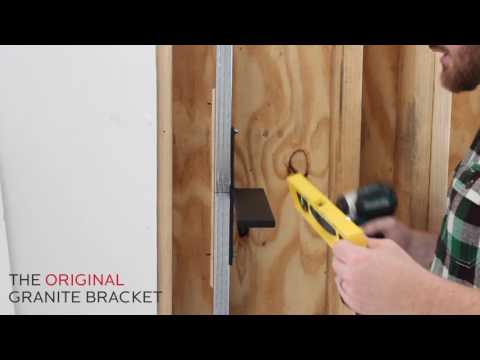 
                  
                    Load and play video in Gallery viewer, An instructional video from The Original Granite Bracket that gives detailed instructions on how to install a free hanging shelf bracket to metal studs.
                  
                
