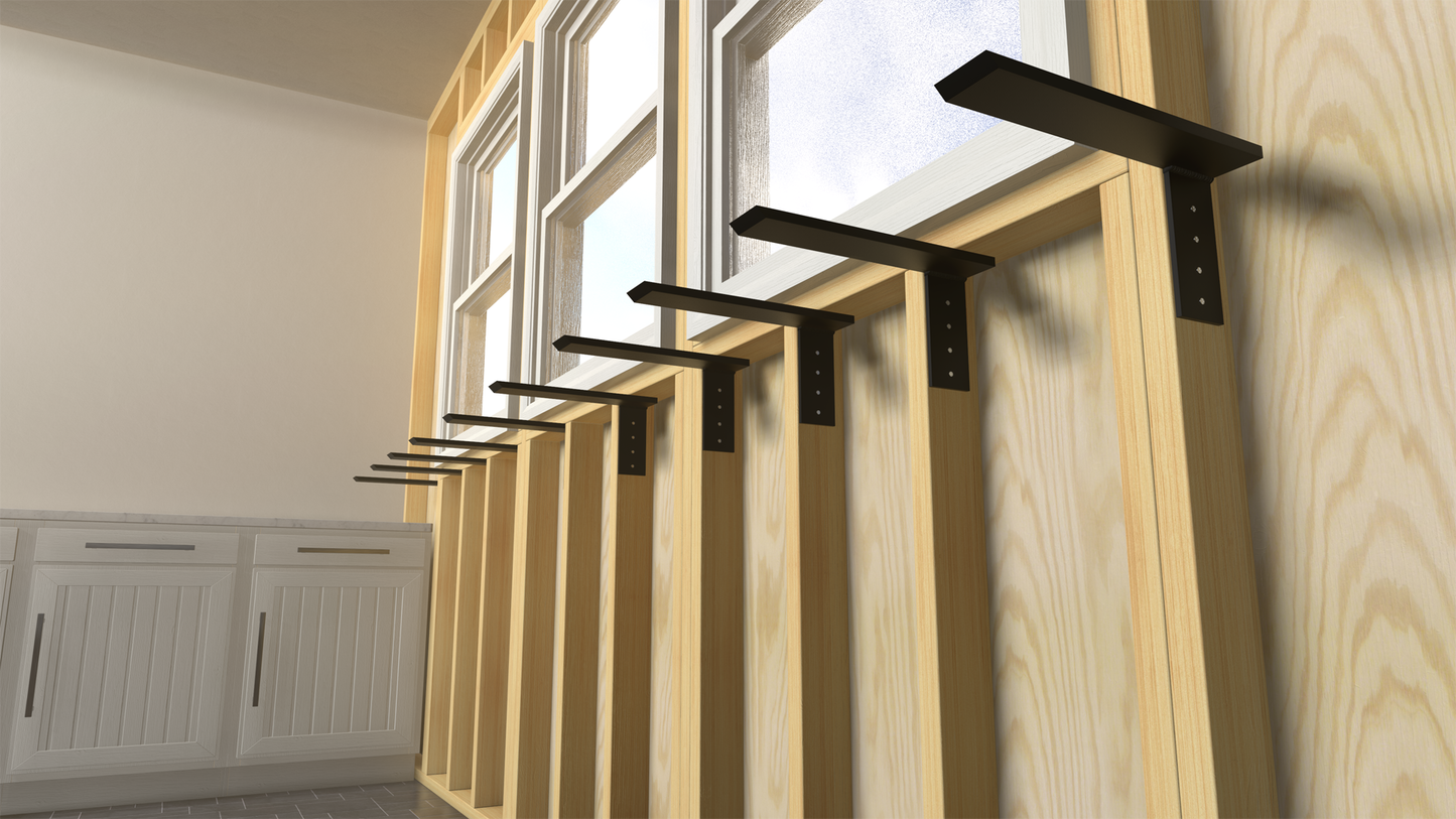 
                  
                    10 side wall free hanging shelf brackets attached to an unfinished exposed wooden wall under three windows with a white counter in the backend.
                  
                