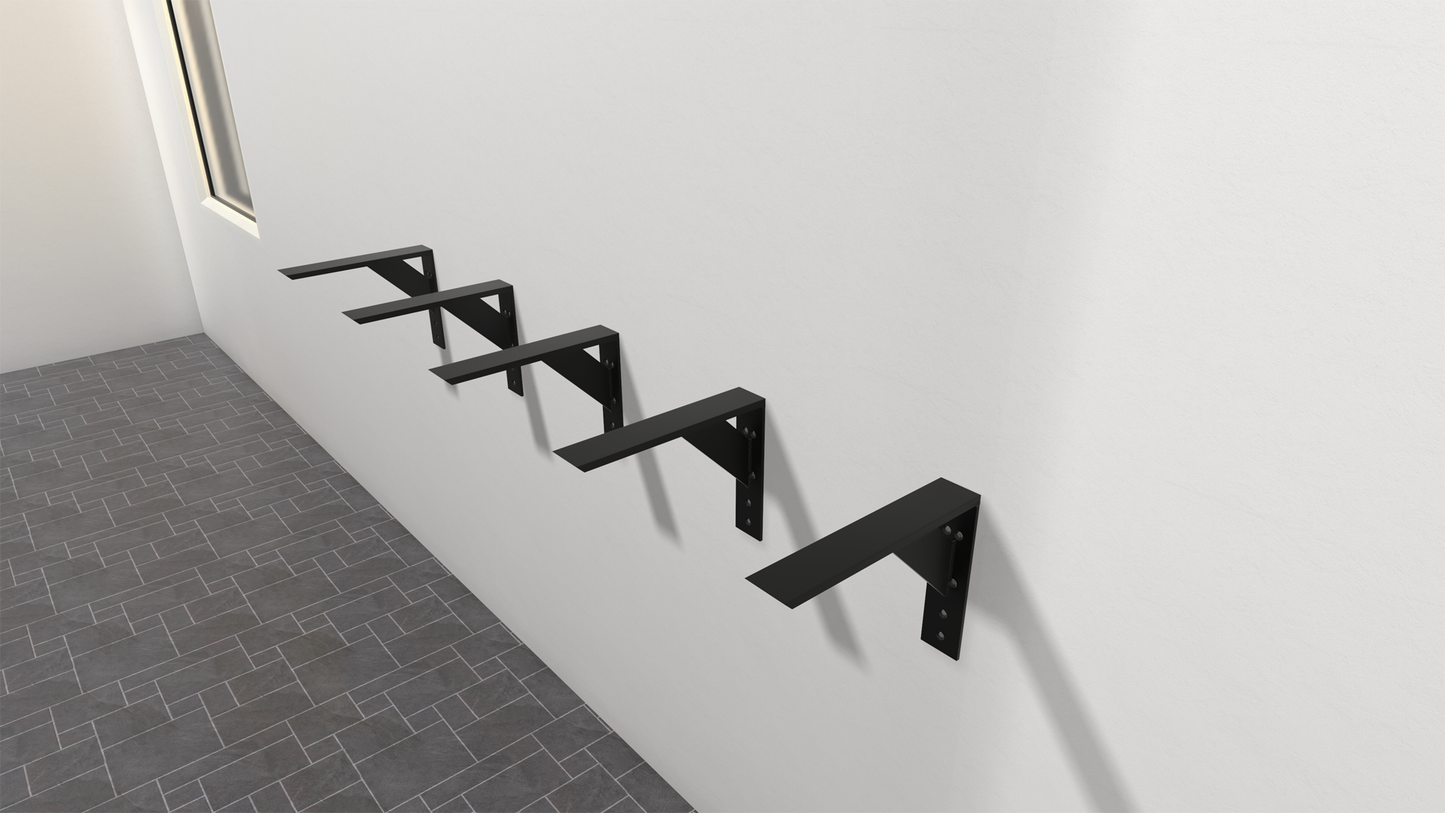 
                  
                    5 black large shelf brackets attached to a white wall with a gray tiled floor and window in the background.
                  
                