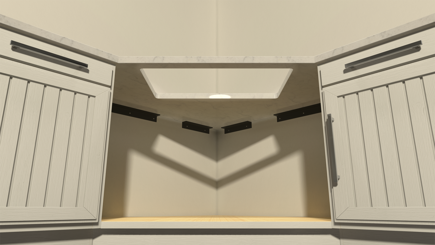 Underside view of four black sink support brackets holding up a counter top with a hole cut out for a sink.